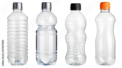 Four empty plastic water bottles with different shapes and colorful screw caps