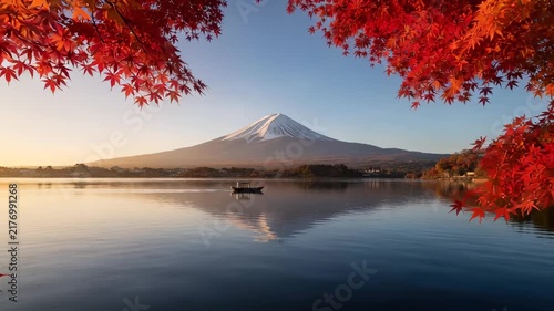 Vibrant Autumn Foliage Framing Serene Mountain Lake Landscape at Sunrise