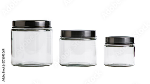Three empty clear glass storage jars with brushed metal screw lids in varying sizes