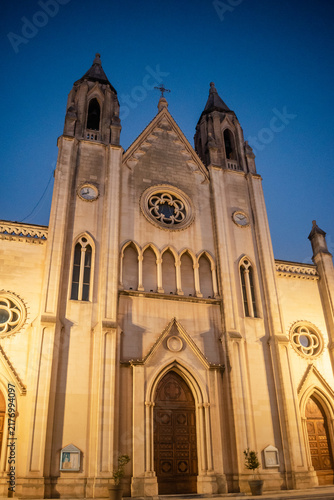 Monumental facade of the neo-Gothic Church of Our Lady of Mount Carmel with bell towers and rose windows, St. Julian's MALTA