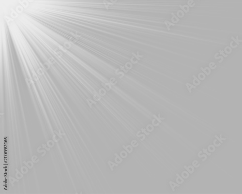 A concentrated bright white light source beams from the upper left corner. Soft, elongated rays radiate outward diagonally across the dark background. This light effect creates a dramatic.