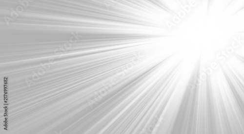 фотографія A radial burst of intense white light shines from the upper right corner