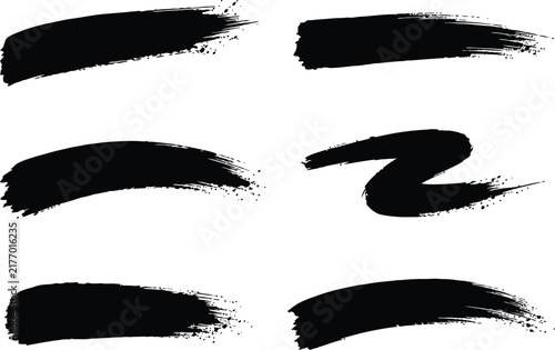 Diverse collection of black grunge brushes artistic strokes and abstract paint splatters for creative projects