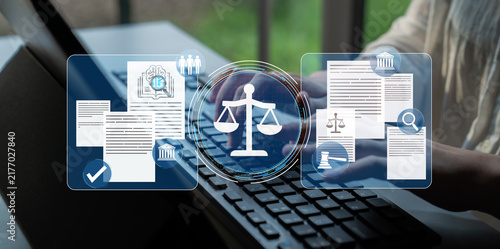 Obraz na płótnie Legal Themes and Concepts in Digital Law Practice with Professional Hands Typing on Laptop in Modern Law Office Environment