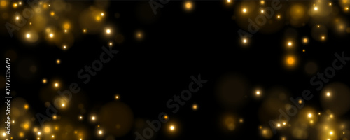Photography Scattered golden lights create a shimmering bokeh effect across a dark background