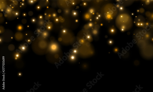Konstfotografi Soft glowing orbs scatter across a dark background creating a warm bokeh effect
