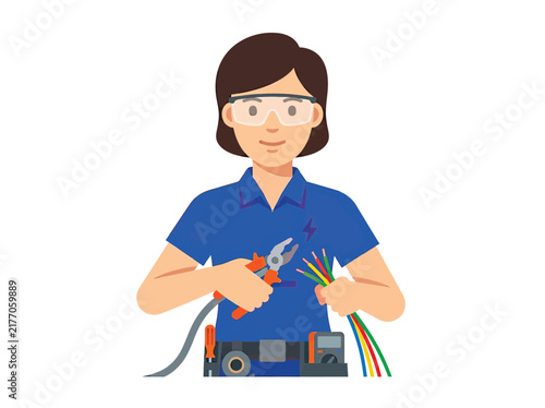 Female electrician holding pliers and wires, wearing safety glasses and tool belt