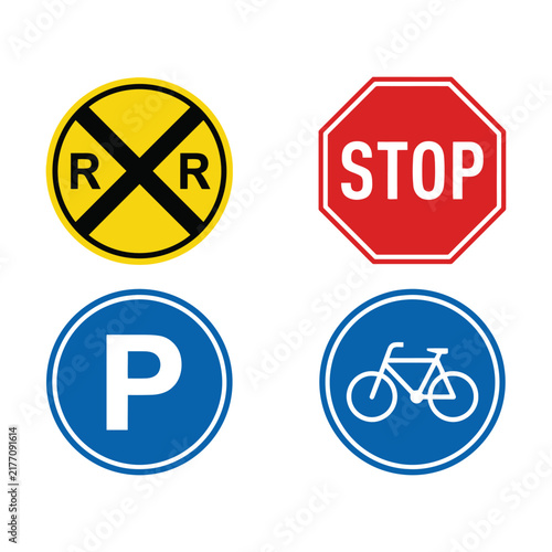Set of four common road signs including railroad crossing stop parking and bicycle lane icons Vector
