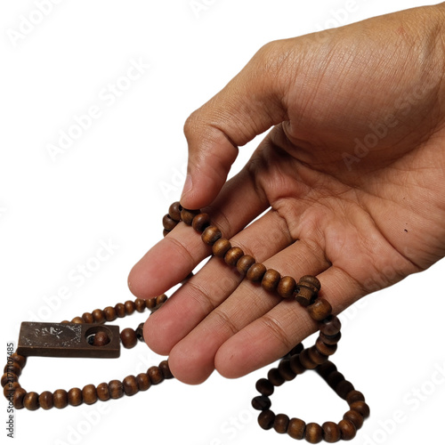 Cuadro en lienzo hand holding brown wooden prayer beads or tasbih