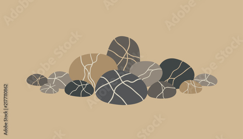 Collection of natural smooth river stones arranged in a cluster with intricate white vein patterns on a light tan beige studio background.