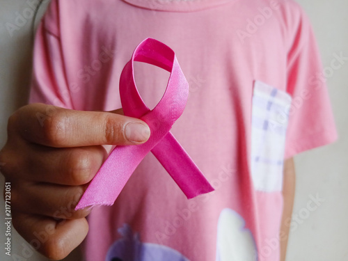 Фотография Person holding pink ribbon symbol for breast cancer awareness month campaign