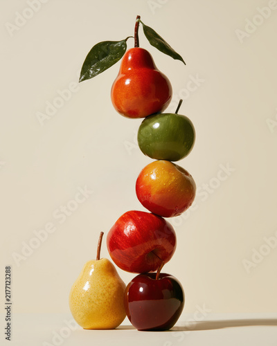 Balanced fruit tower with pear, apple and glossy leaves