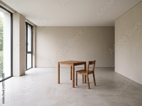 Minimalist wooden dining table and chairs in a spacious modern interior
