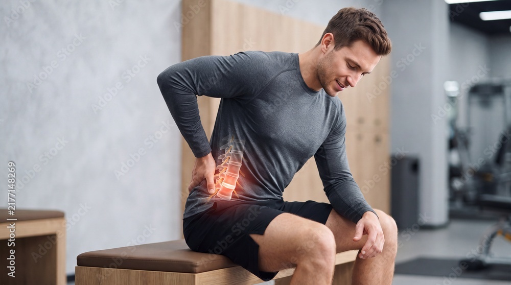 Naklejka premium Young Man Suffering from Lower Back Pain with Lumbar Spine Illustration