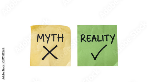 Concept of myth versus reality with checkmark and cross symbols on sticky notes