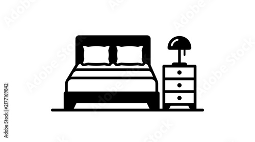 Minimalist black vector illustration showing a cozy bedroom set including a wide bed with pillows and a bedside nightstand lamp