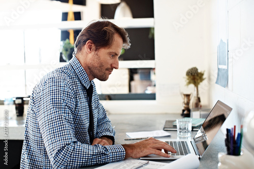 Konstfotografi Laptop, research and reading with business man in office for account review, budget treasurer and planning
