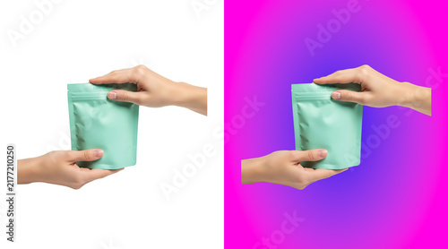Bild auf Leinwand Hands holding a small mint green matte pouch bag isolated on a white background,