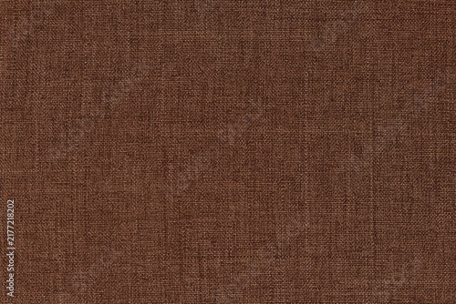 Dark brown fabric texture for background and design art work with seamless pattern of natural textile.