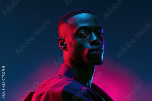Retro synthwave portrait of a stylish African man under neon studio lights