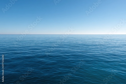 Serene ocean scene with smooth blue gradients and a distant horizon