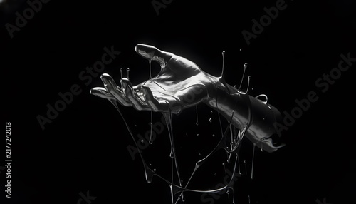 Metallic human hand reaching out with liquid drips