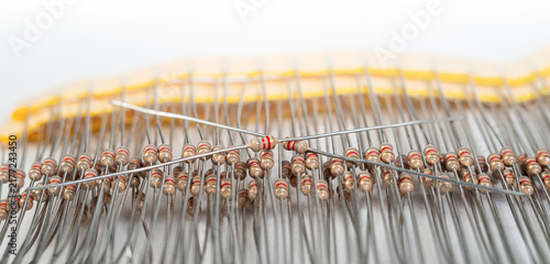 Resistors arranged on a circuit board with wires visible in a workspace