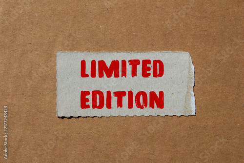 Fotografie Limited Edition message written on ripped torn paper background