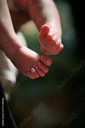 Newborn baby feet showing innocence and tenderness