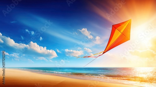 A bright kite soaring above a serene beach during sunset, with clouds and ocean waves