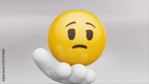 A 3D rendered yellow face emoji expressing sadness or worry, gently supported by a stylized white hand, symbolizing empathy, emotional support, and common feelings of distress