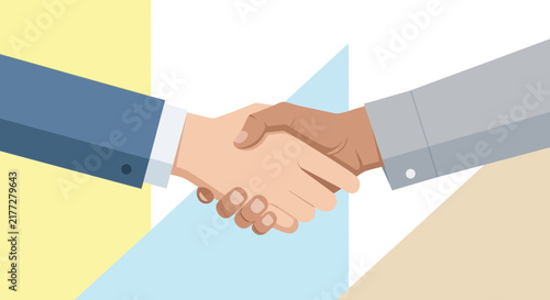 Hand holding a blue puzzle piece over a gap in a puzzle.