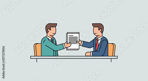 Two business professionals collaborating on a laptop in modern office.