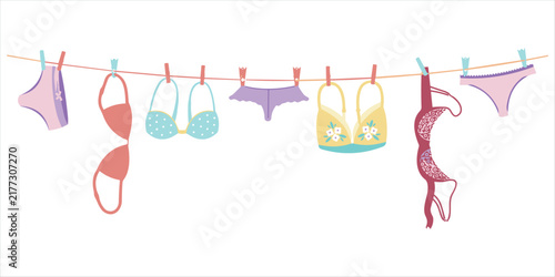 Foto A colorful of various women's lingerie including bras and panties, hanging on a