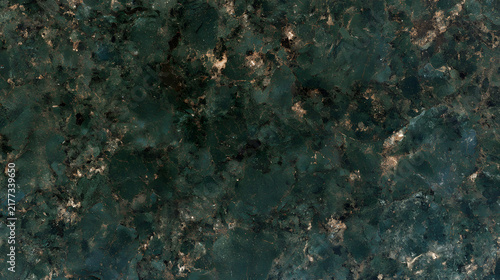 Textured green granite surface with subtle highlights and patterns.