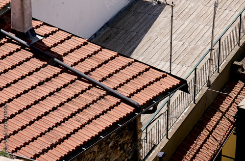 Tiled roofs and a terrace in a stone village