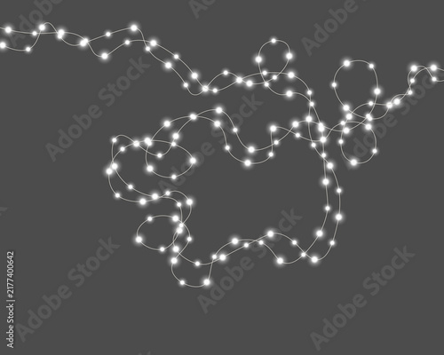 Konstfotografi A string of glowing white lights twists and loops freely against a black background