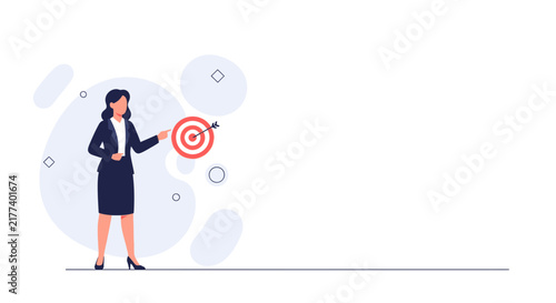 Businesswoman points to bullseye target with arrow, illustrating goals, strategy, and success in business and career.