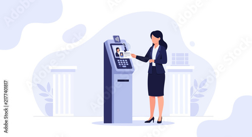 Businesswoman uses contactless card at ATM for secure transaction, symbolizing financial technology and modern banking.