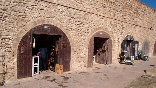 Konstfotografi Gift shops in small rooms built into the old fortification walls of the medina,