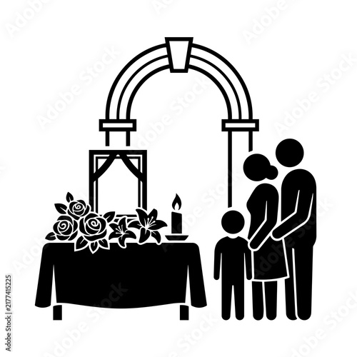 Canvas Print Family standing by funeral memorial table with flowers and photo frame