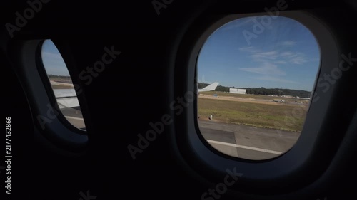 Static Airplane Window View Over Airport Runway Landscape