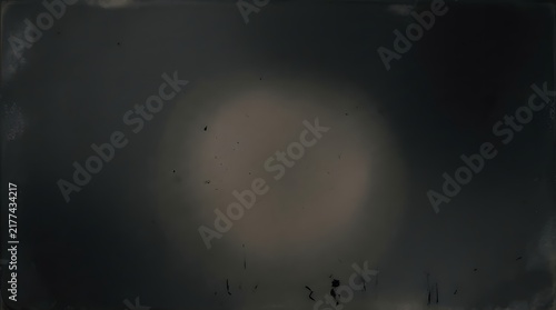 Abstract dark background featuring a charcoal grain atmosphere with subtle light gradients and a deep moody textured artistic surface