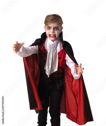 A boy dressed in a vampire costume