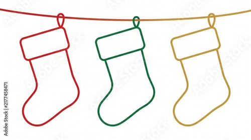 three minimalist outline christmas stockings hanging on string. red, green and golden colors against white background. winter holiday decoration. greeting card, banner, website header with copyspace.