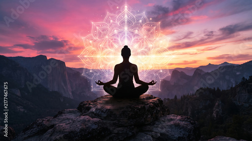 Silhouette Meditating on Mountain Peak at Glowing Geometric Sunrise.