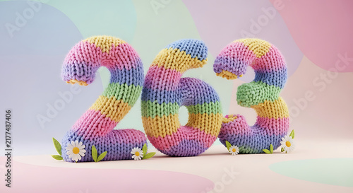 Chunky knitted number 263 in rainbow pastel colors, adorned with small daisies and green leaves.