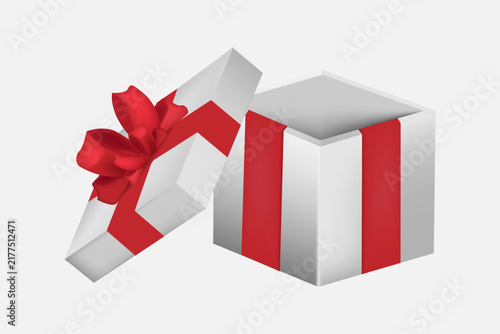 Open white gift box with red ribbon bows and with with red confetti. 
