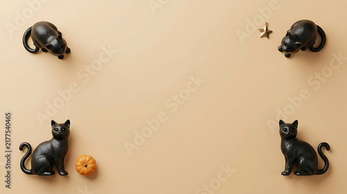 Four black cat figurines arranged on a neutral background