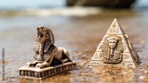 Fotografía Ancient Egyptian symbols rest near water's edge